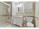 Bathroom with walk-in shower and white vanity at 901 Normandy Trace Rd, Tampa, FL 33602