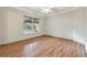 Bedroom with wood-look tile flooring and large window at 901 Normandy Trace Rd, Tampa, FL 33602