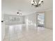 Spacious living room with tile flooring, plantation shutters, and bright natural light at 901 Normandy Trace Rd, Tampa, FL 33602