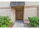 Well-maintained townhouse front door with landscaping, showing a welcoming entrance at 901 Normandy Trace Rd, Tampa, FL 33602