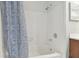 Bathroom with shower/tub combo and patterned curtain at 901 Normandy Trace Rd, Tampa, FL 33602