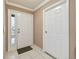 Bright and airy entryway with tile flooring and neutral color palette at 901 Normandy Trace Rd, Tampa, FL 33602