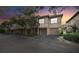Townhouse exterior showcasing a charming three-unit building with attached garages at 901 Normandy Trace Rd, Tampa, FL 33602