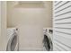 Laundry room with washer and dryer, and extra shelving at 901 Normandy Trace Rd, Tampa, FL 33602