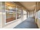 Screened porch with gray tile flooring and view at 901 Normandy Trace Rd, Tampa, FL 33602