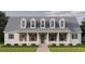 Charming two-story home with gray roof and shutters at 965 48Th N Ave, St Petersburg, FL 33703