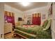 Green quilt and white dresser featured in this bedroom at 1010 Plaza St, Clearwater, FL 33755