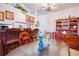 Bright dining area features a glass-topped table and wooden hutch at 1010 Plaza St, Clearwater, FL 33755