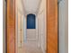 Hallway with wood flooring and blue accent wall at 12611 River Birch Dr, Riverview, FL 33569