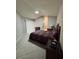 Main bedroom with carpet and access to the bathroom at 1404 Woodstream Dr, Oldsmar, FL 34677