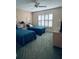 Guest bedroom with two twin beds and window with shutters at 1404 Woodstream Dr, Oldsmar, FL 34677