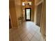 Bright entryway with tile floors and stained-glass door at 1404 Woodstream Dr, Oldsmar, FL 34677