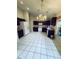 Kitchen with dark wood cabinets and granite countertops at 1404 Woodstream Dr, Oldsmar, FL 34677