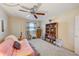 Bedroom featuring a futon, bookshelf, and ceiling fan at 1900 59Th N Ave # 305, St Petersburg, FL 33714