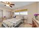Bright bedroom with a double bed, window, and ceiling fan at 1900 59Th N Ave # 305, St Petersburg, FL 33714