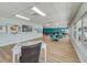 Community room with tables, chairs, and a large window at 1900 59Th N Ave # 305, St Petersburg, FL 33714