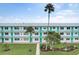 Two-story building with teal accents and landscaping at 1900 59Th N Ave # 305, St Petersburg, FL 33714