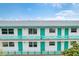 Two-story building with teal accents and balconies at 1900 59Th N Ave # 305, St Petersburg, FL 33714
