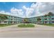 Two-story building with teal accents and courtyard at 1900 59Th N Ave # 305, St Petersburg, FL 33714