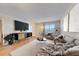 Virtually staged living room featuring a neutral color palette and ample natural light at 1900 59Th N Ave # 305, St Petersburg, FL 33714