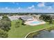An aerial view of a community pool, recreation area, and surrounding landscape at 1900 59Th N Ave # 305, St Petersburg, FL 33714