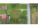 An aerial view of a vacant lot near a road and houses at 2010 Sammonds Rd, Plant City, FL 33563