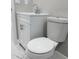 White vanity with sink and toilet in updated bathroom at 2643 Almond Dr, Holiday, FL 34691