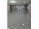 Bright living room with white tile floors and French doors at 2643 Almond Dr, Holiday, FL 34691