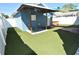 Inviting backyard with artificial turf, covered patio, and outdoor hot tub at 2918 10Th N St, St Petersburg, FL 33704