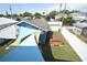 Aerial view of backyard with artificial grass, hot tub, shade sail, and white fence at 2918 10Th N St, St Petersburg, FL 33704