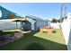 Outdoor space with artificial turf, covered seating, and hot tub at 2918 10Th N St, St Petersburg, FL 33704