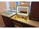 Bathroom vanity with vessel sink, granite countertop, lighted mirror, and custom wood cabinets at 2918 10Th N St, St Petersburg, FL 33704