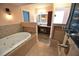 Spa-like bathroom featuring a jacuzzi tub and a walk-in shower at 2918 10Th N St, St Petersburg, FL 33704