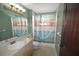 Bathroom with anchor-themed shower curtain and vanity at 2918 10Th N St, St Petersburg, FL 33704