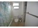 A bathroom with blue shower curtain and toilet at 2918 10Th N St, St Petersburg, FL 33704