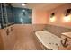Bathroom features a walk-in shower with blue tiles and a soaking tub with mosaic tile accents at 2918 10Th N St, St Petersburg, FL 33704