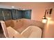 Bathroom features a walk-in shower with blue tiles, towel rack, and a soaking tub with mosaic tile accents at 2918 10Th N St, St Petersburg, FL 33704