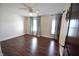 Bedroom with hardwood floors, ceiling fan, and two large windows at 2918 10Th N St, St Petersburg, FL 33704