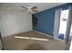 Bedroom features an accent wall and view of a walkout deck at 2918 10Th N St, St Petersburg, FL 33704