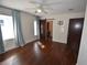 Bedroom featuring hardwood floors, barn door, and curtains at 2918 10Th N St, St Petersburg, FL 33704