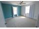 Sunny bedroom features a bright accent wall, bright windows and light carpet at 2918 10Th N St, St Petersburg, FL 33704