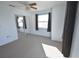 Bright bedroom with neutral carpet, a ceiling fan, and large window, offering ample natural light at 2918 10Th N St, St Petersburg, FL 33704