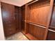 This walk-in closet boasts a custom wood closet system and wood-look tile floor at 2918 10Th N St, St Petersburg, FL 33704