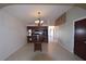 Open dining room with chandelier and view into kitchen and hallway at 2918 10Th N St, St Petersburg, FL 33704