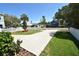 Long driveway and grassy front yard of a charming home with a well-maintained lawn at 2918 10Th N St, St Petersburg, FL 33704