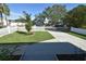 Charming home featuring a lush front lawn with a classic white picket fence at 2918 10Th N St, St Petersburg, FL 33704