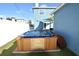 Backyard hot tub with wood surround situated on a lush, grassy area at 2918 10Th N St, St Petersburg, FL 33704