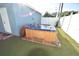Outdoor hot tub features wood surround and stairs, perfect for relaxation at 2918 10Th N St, St Petersburg, FL 33704