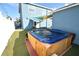 Hot tub in backyard with artificial turf at 2918 10Th N St, St Petersburg, FL 33704