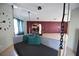 Open-concept living room with hanging daybed, adjacent dining area, and stylish decor at 2918 10Th N St, St Petersburg, FL 33704